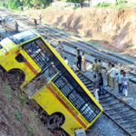 School bus rolls into railway track